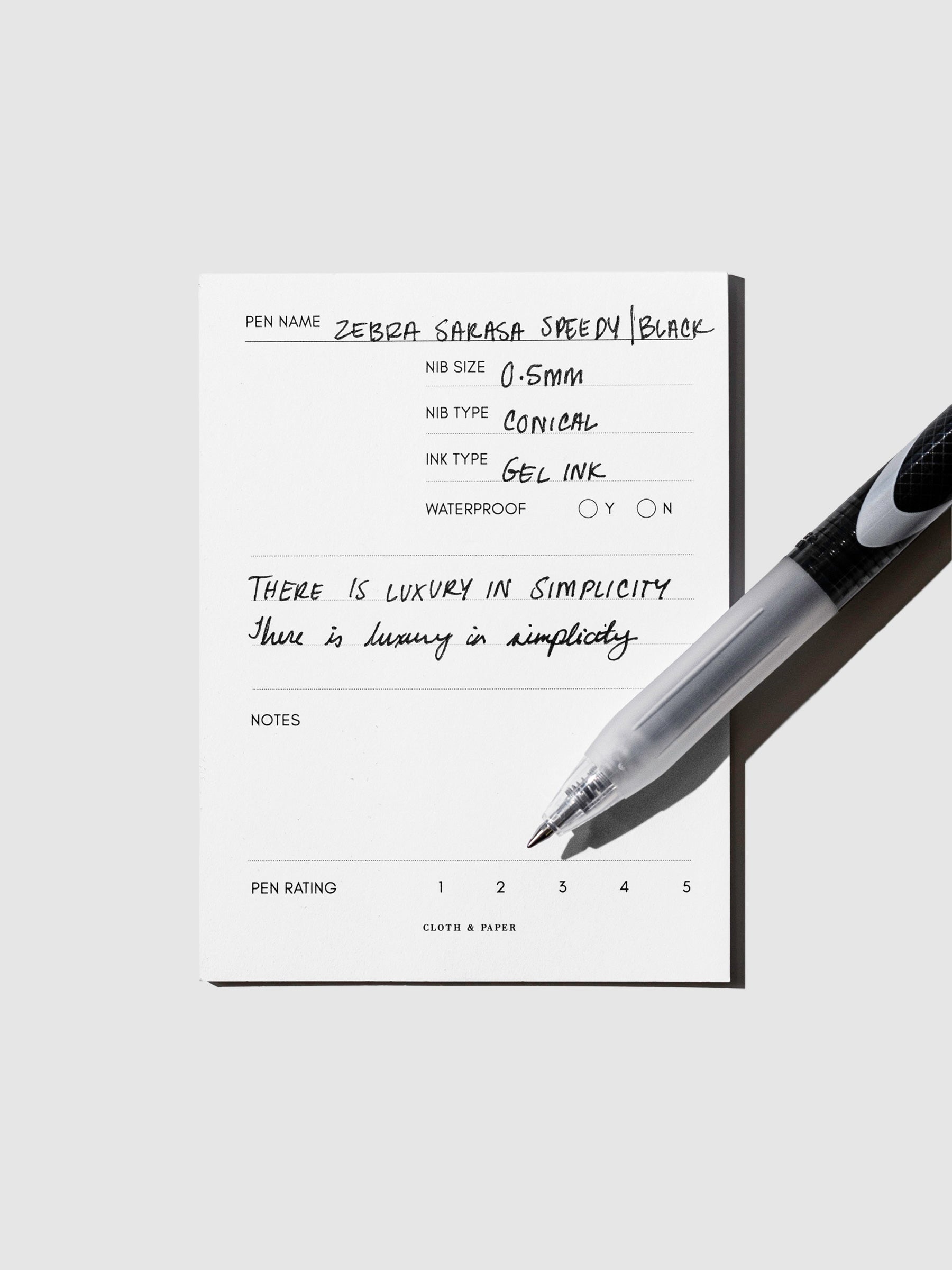 Pen displayed on top of an in use pen testing sheet.