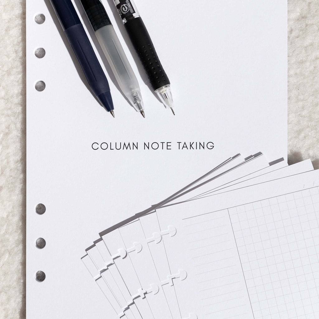 Title page of insert displayed on a fuzzy, textured surface. Two pens, a pencil, and several sheets of discbound Column Note Taking inserts are layered strategically over the title page.