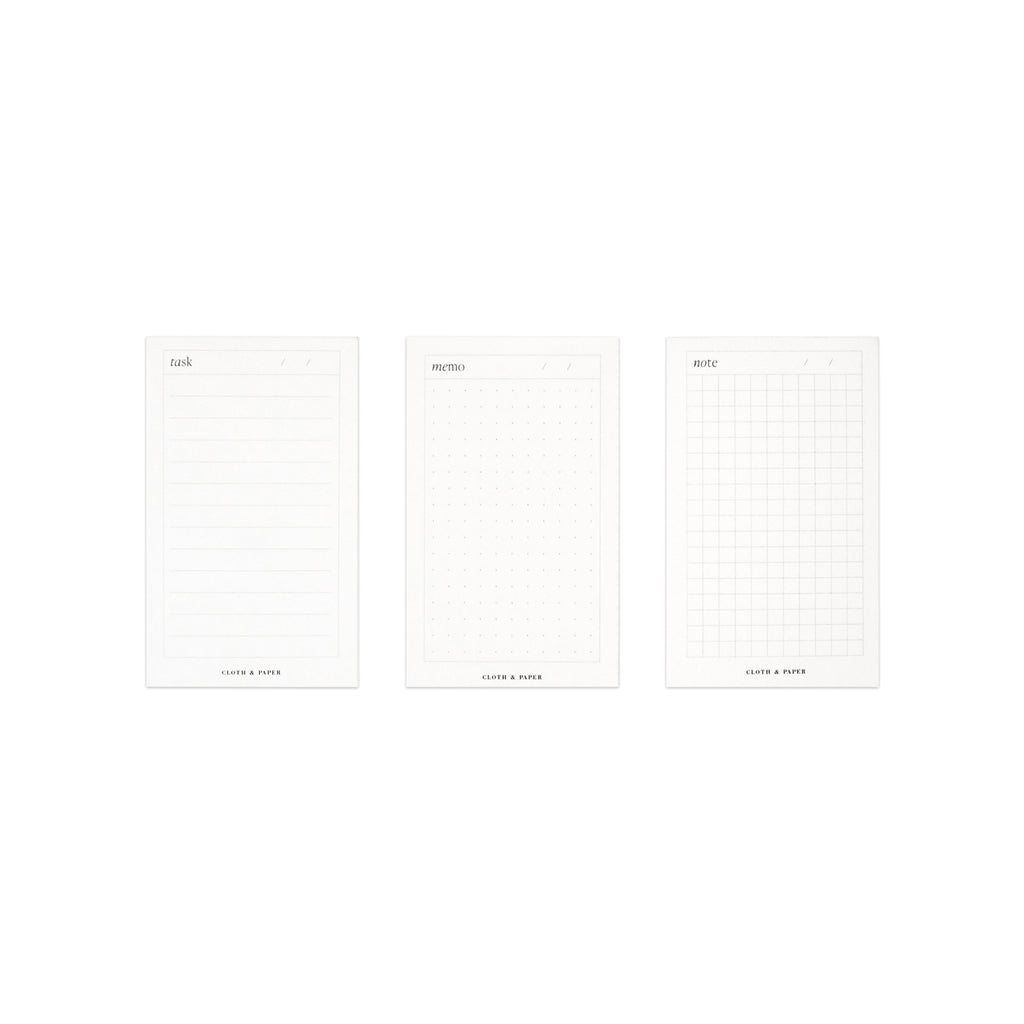Mini Task, Memo, and Note Notepads all lined up parallel to each other in a line. The line of notepads against a white background.