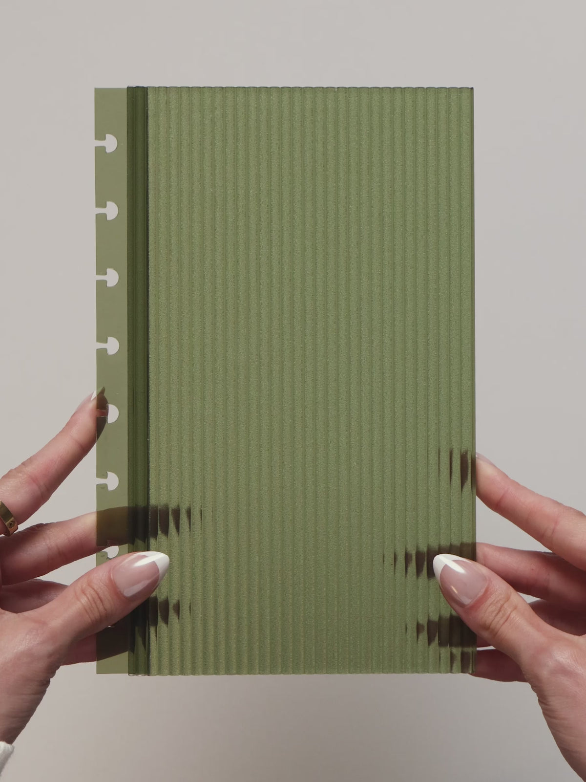 Video showing the fluted dashboard being displayed in multiple colors and textures, then placed inside a planner to demonstrate how it fits and looks when installed.