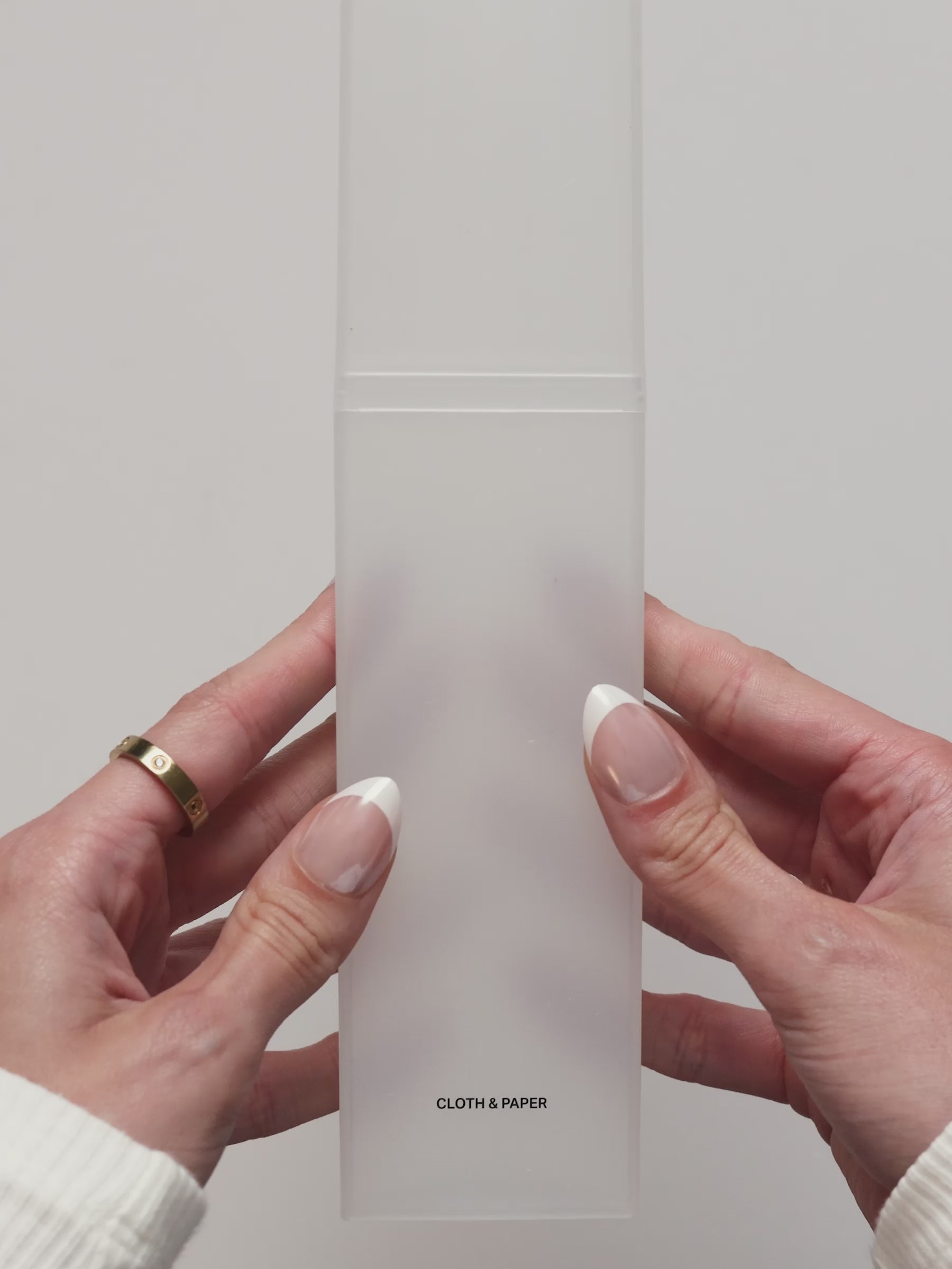 Video showing the frosted pencil box being opened and filled with writing tools. 