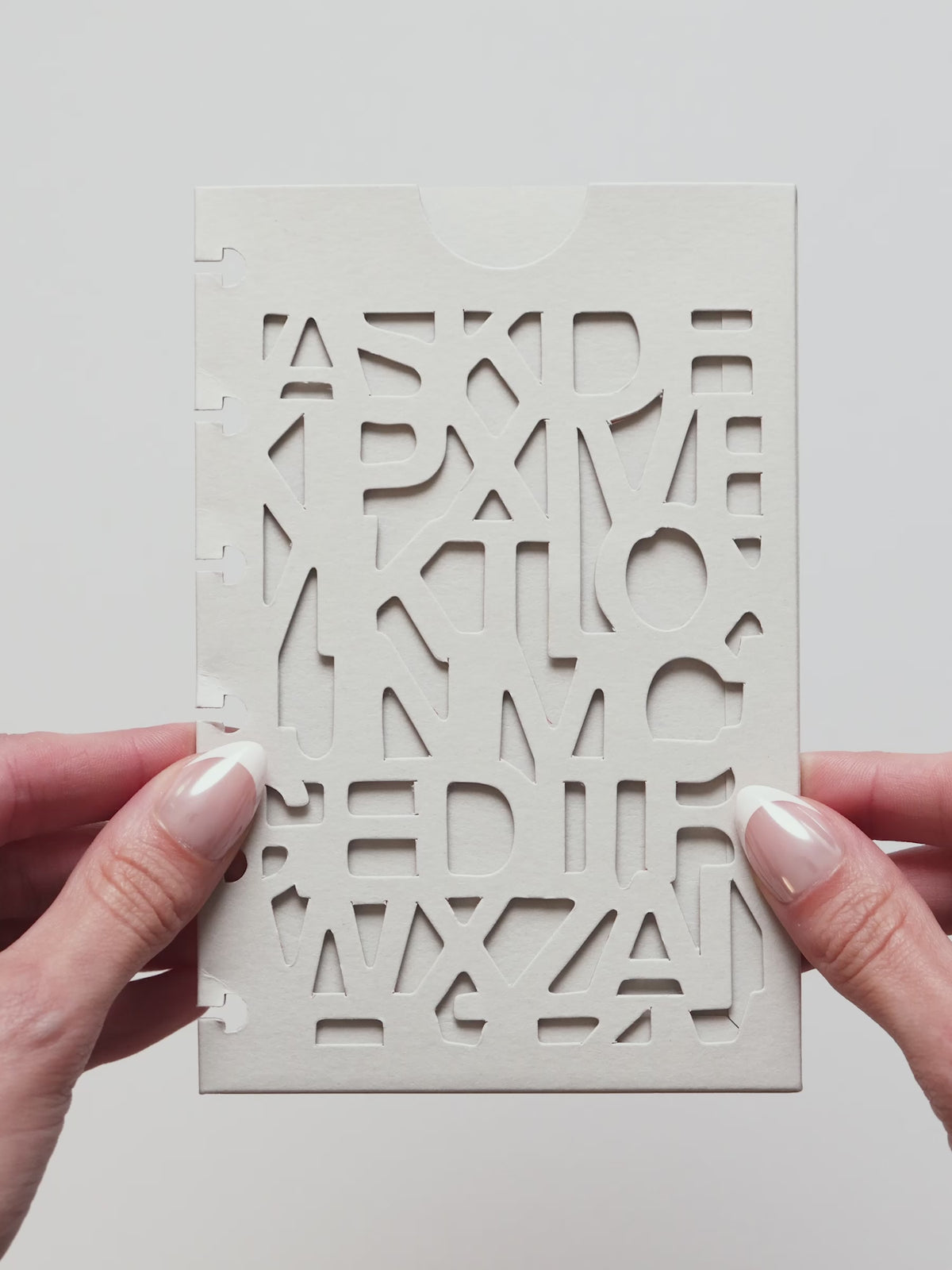The A5 6-Ring Punch Diecut Pocket Folder video, showing the front panel cut through with the Precision letter pattern and the half moon notch at the top