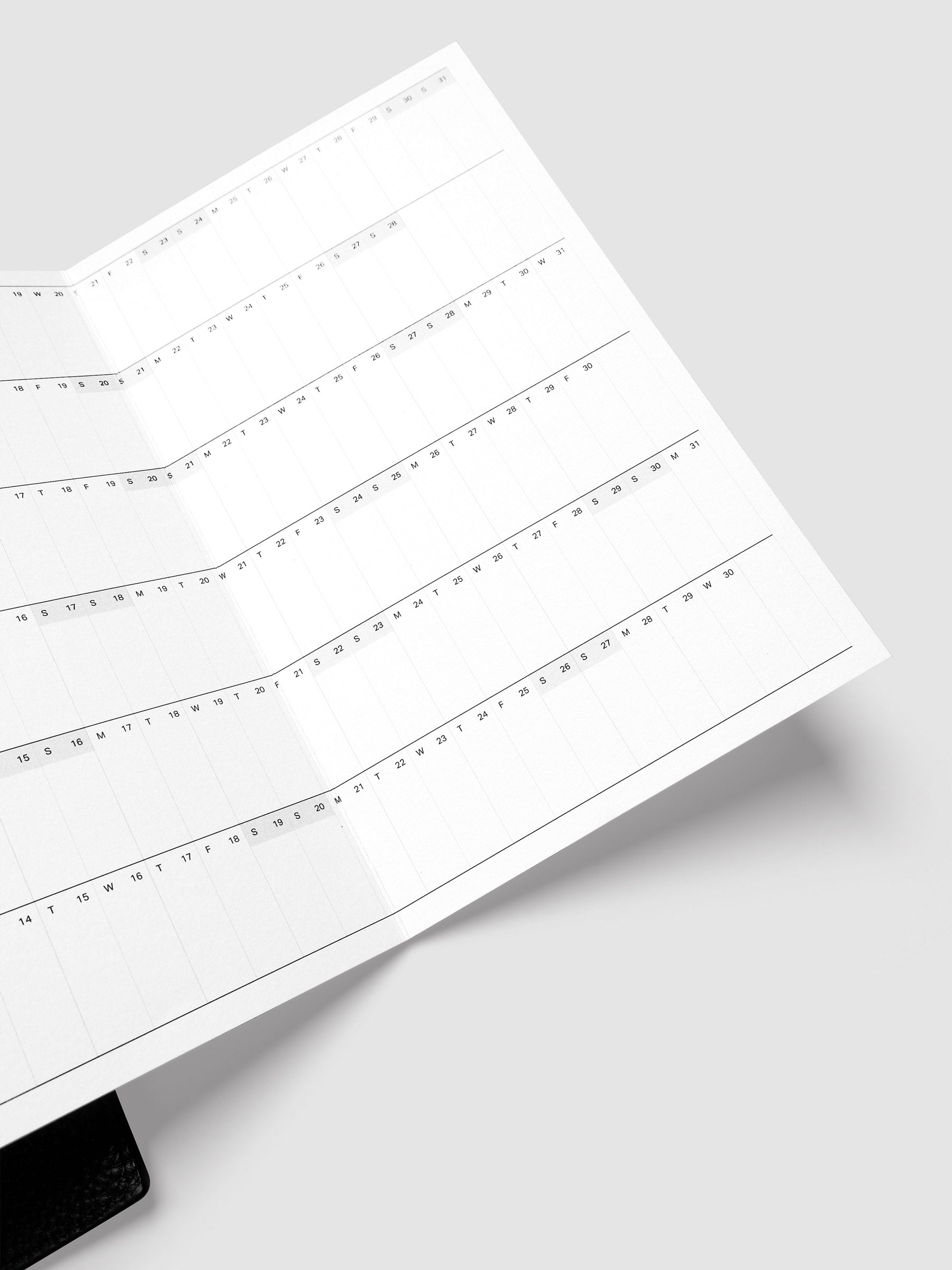 Close-up of the 2027 Dated Fold Out Insert inside an A5 6-ring planner, showing the small daily boxes used to mark holidays, birthdays, and key dates
