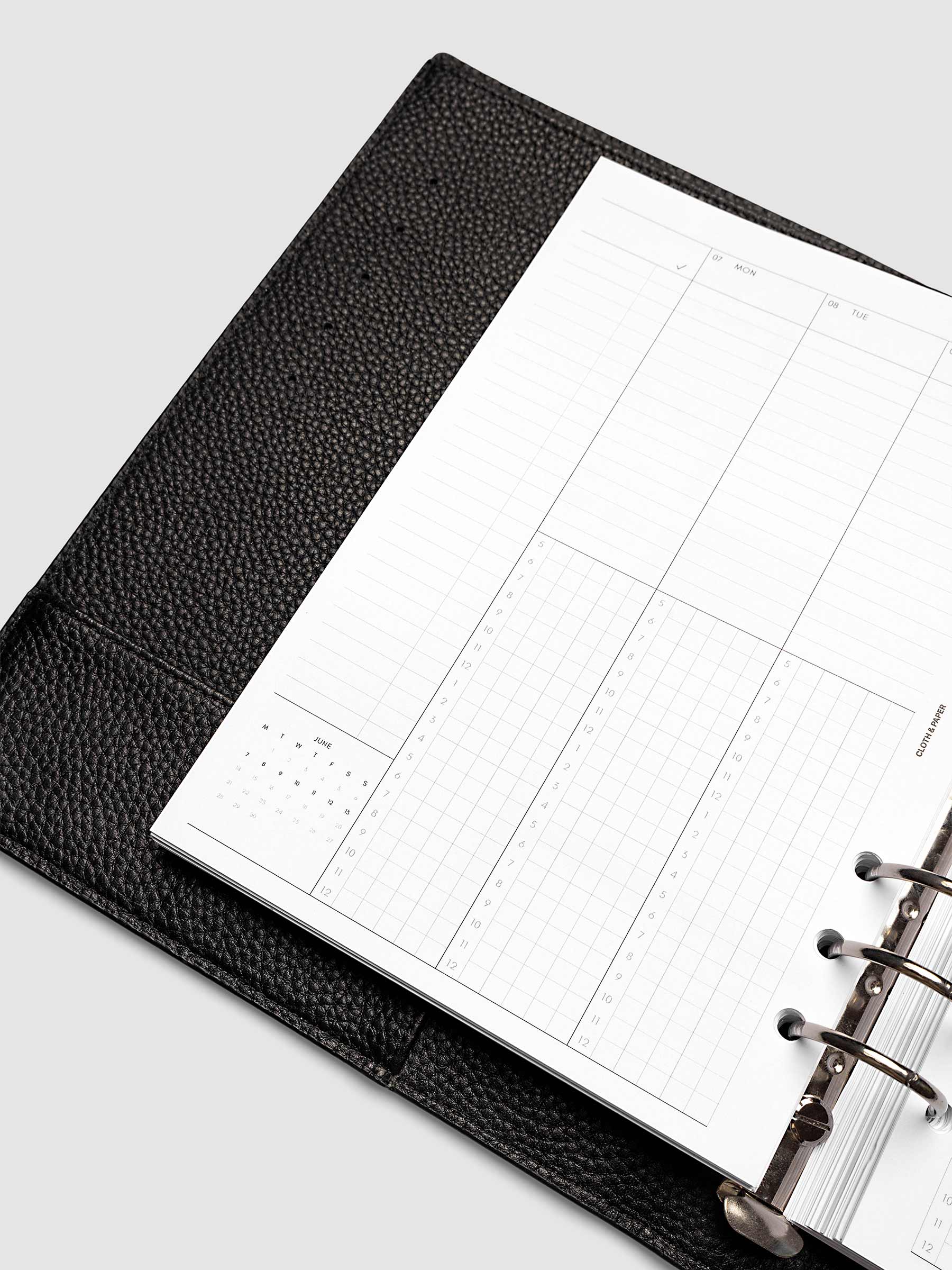 A5 6-Ring Punch left page detail showing task column, mini monthly calendar, and lined section in a planner