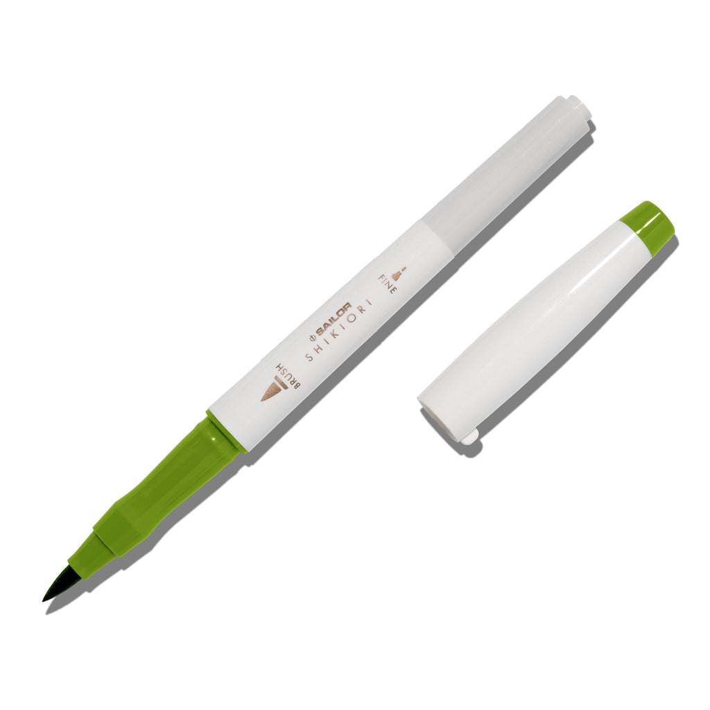 Brush pen displayed on a white background. It is uncapped with its brush nib exposed, and the cap lying parallel to the marker. Color pictured is Wakauguisu. 