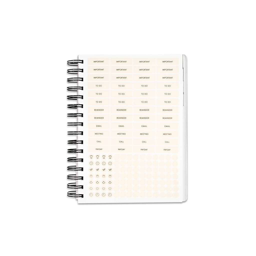 Planner Stickers in a 2022 Spiral Bound Planner against a white background