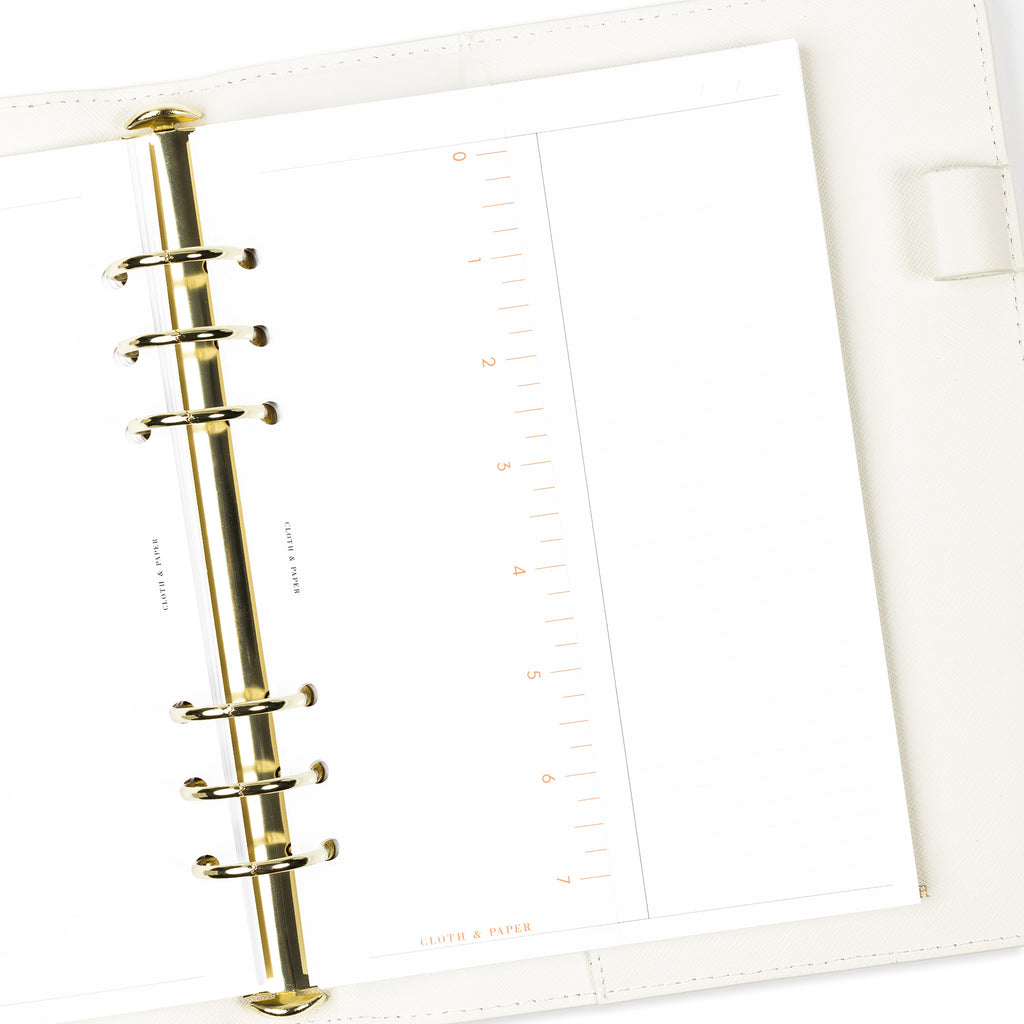 Page marker in use inside a white leather 6-ring agenda.