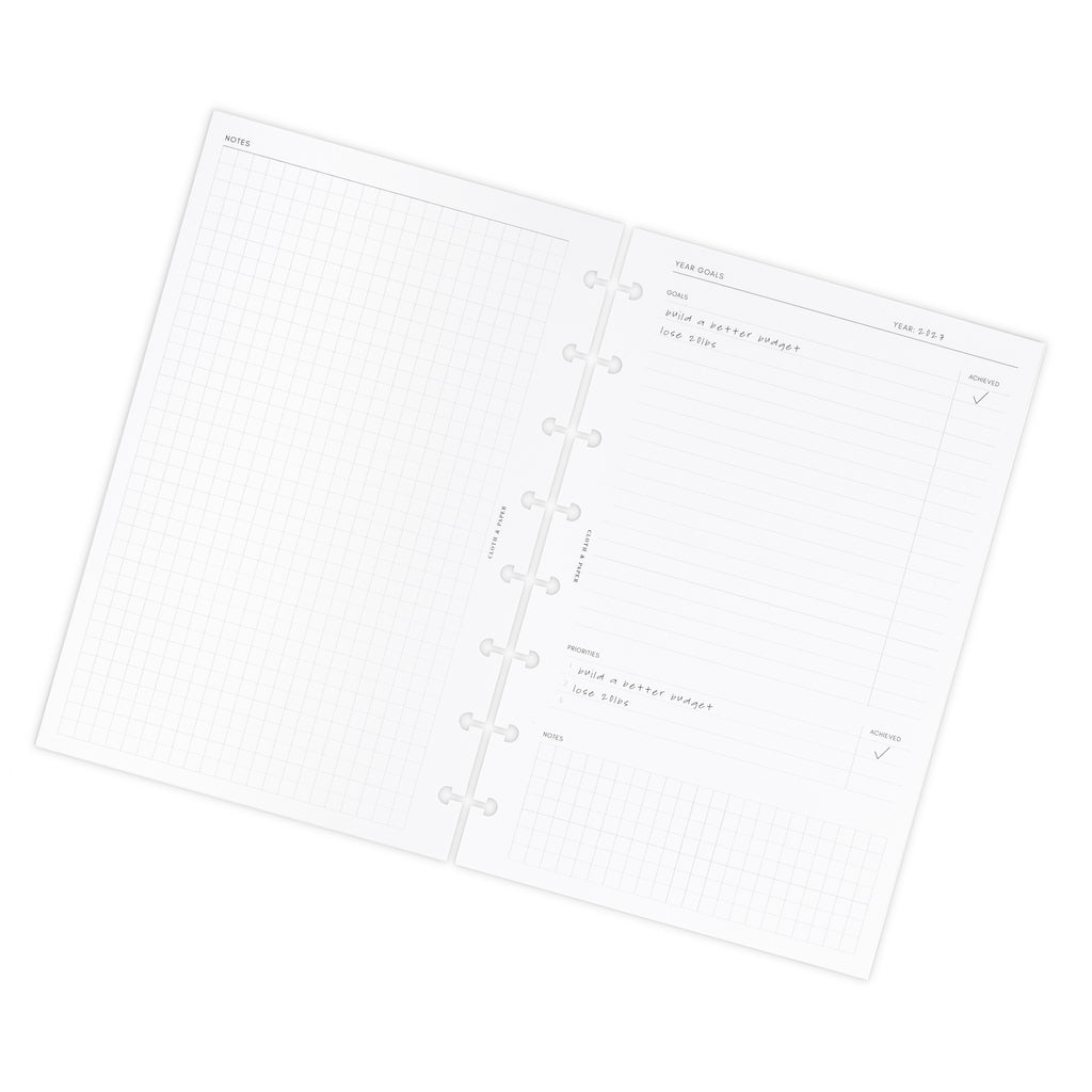 Insert spread on a white background. Spread shown is the notes and year goals page.