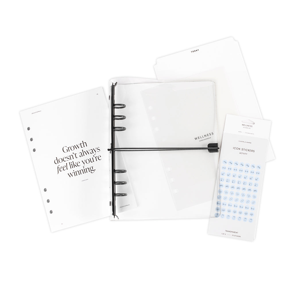 Wellness Bundle, A5, Cloth and Paper. Full bundle contents - clear cover, insert, Today Tab, and planner stickers - are arranged on a white background.