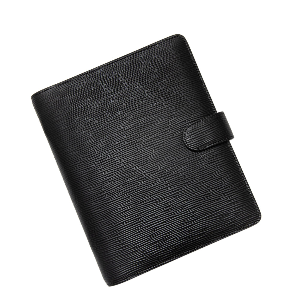 6-Ring Agenda in A5 Size with Black Contoured Leather closed to show the front. The agenda is turned to the left against a white background.
