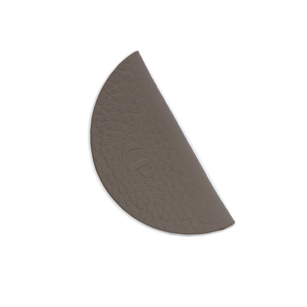 Contoured Fossil leather bookmark.