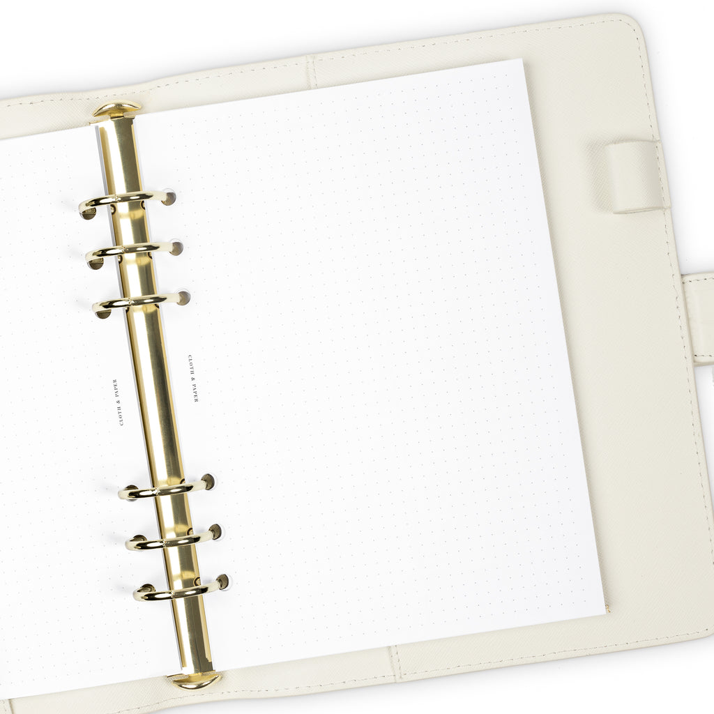 Dot Grid Planner Inserts, Cloth and Paper. Inserts in use inside a white leather agenda with gold rings.