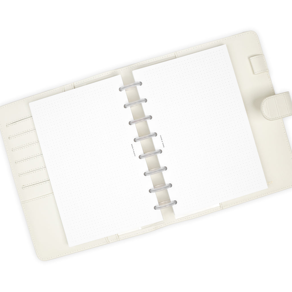 Dot Grid Planner Inserts, Cloth and Paper. Inserts in use inside a white leather agenda with clear discs.