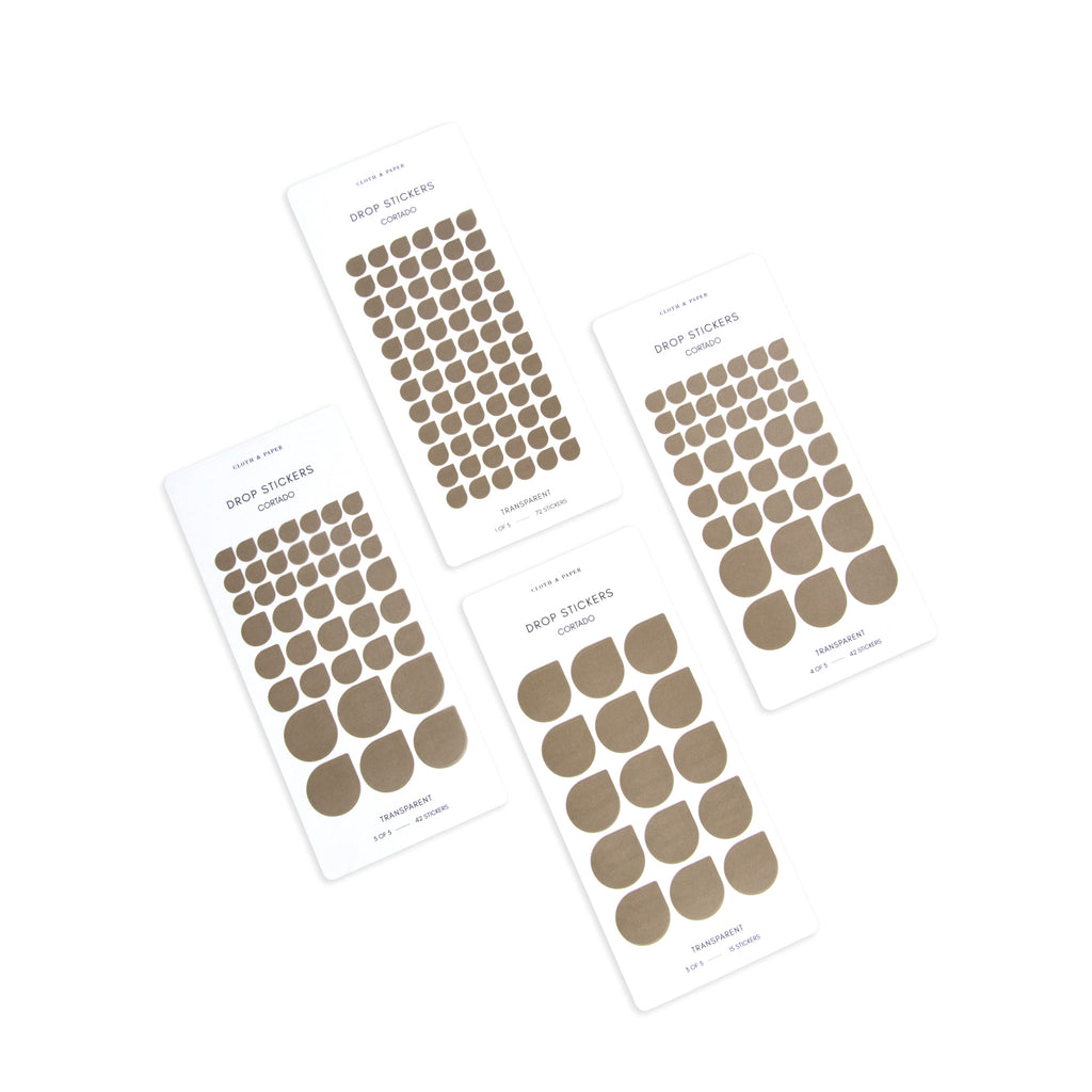 Four sheets of Cortado drop stickers in varying sizes shown parallel to each other on a white background.
