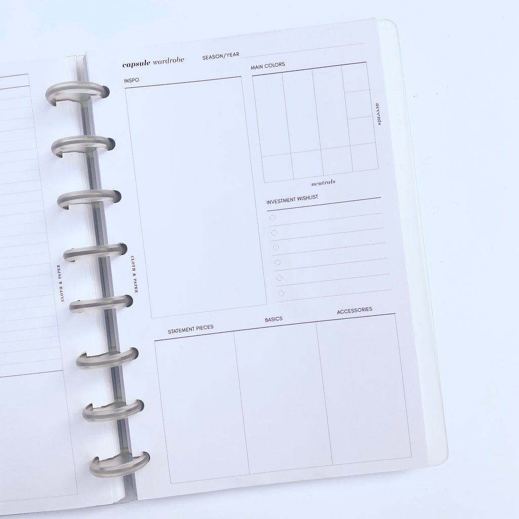 Capsule Wardrobe Inserts inside a discbound planner, with planner opened to insert page.