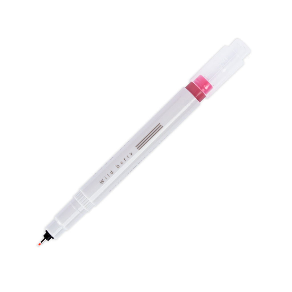 Fineliner marker in Wild Berry with nib exposed and cap posted to the end of its barrel on a white background.