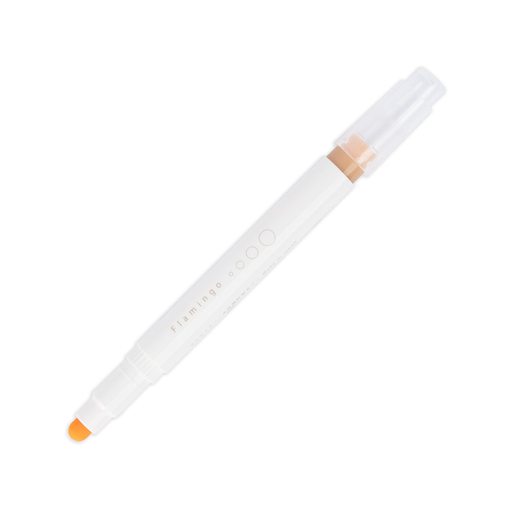Flamingo highlighter with tip exposed and cap posted to the end of its barrel on a white background.