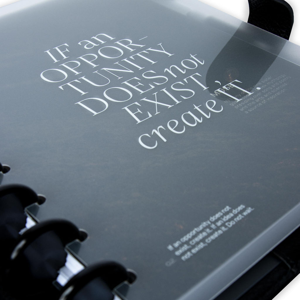 Close up on the bottom left corner of the front cover. There is text at the bottom left corner that reads "If an opportunity does not exist, create it. If an idea does not exist, create it. Do not wait." 