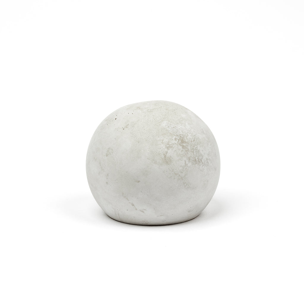 Paperweight, Cloth and Paper. Frontal view of the paperweight on a white background.