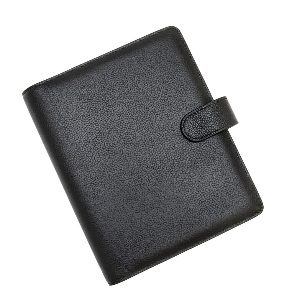 Agenda Cover in size Large with Black Smooth Leather closed to show the front cover, turned to the left against a white background.