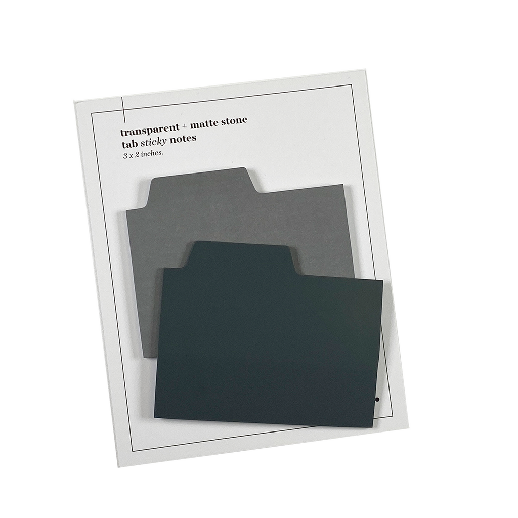 Blank Tab Sticky Note Set, Stone, Cloth and Paper. Sticky note set displayed against a white background. The matte sticky note pad is attached to the sticky note backing, while the transparent sticky note pad is layered on top of it, turned slightly to the right.