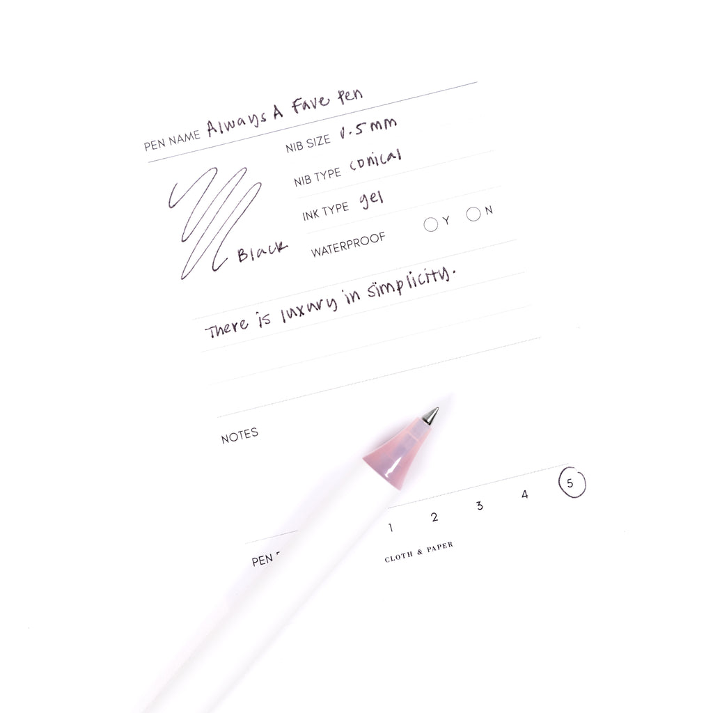 Always a Fave Pen, Pink, Cloth and Paper. Pen resting on pen test sheet displaying writing sample.