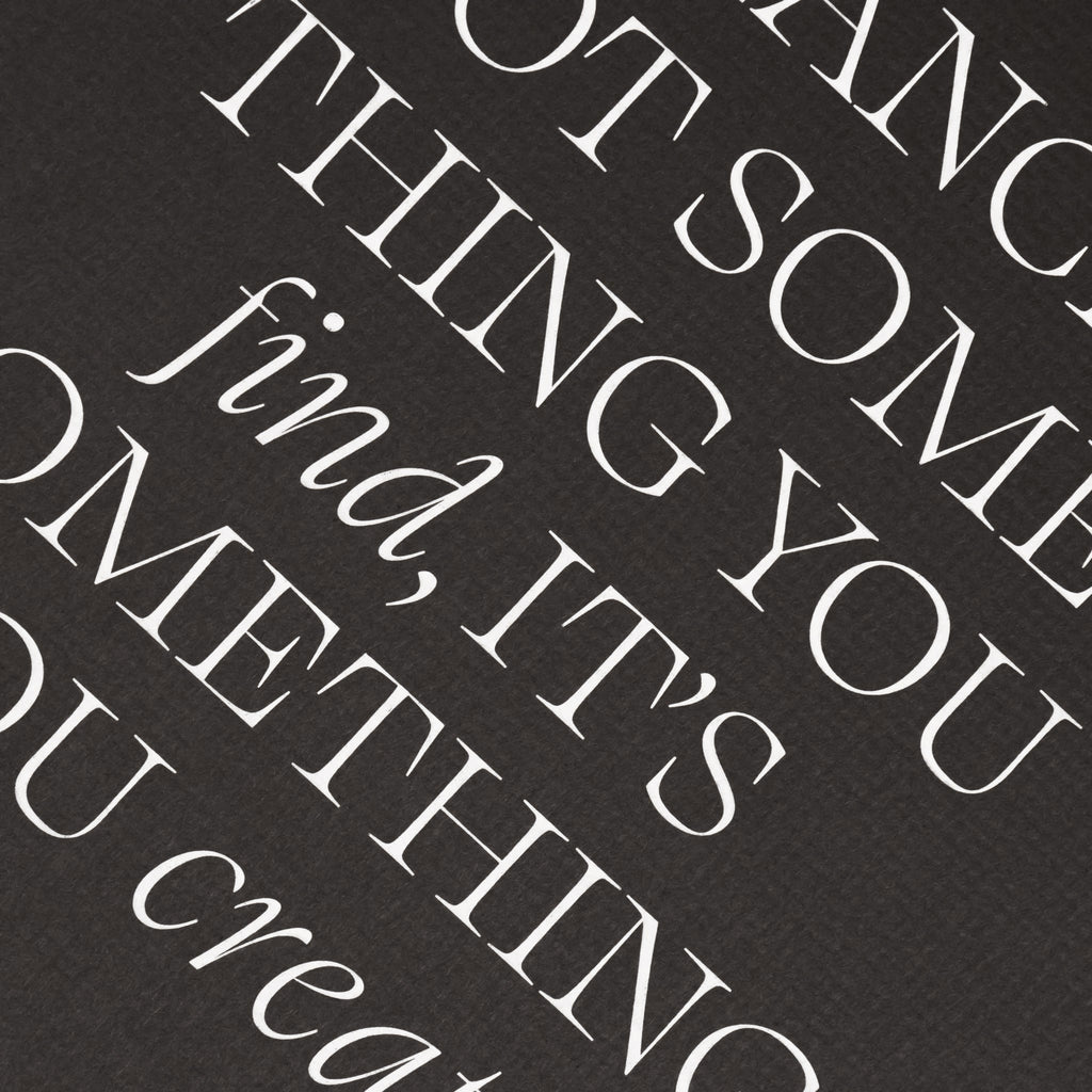 Close up on text at center of dashboard. Text reads "Balance is not something you find, it's something you create" with top and bottom of lettering cut off out of frame.