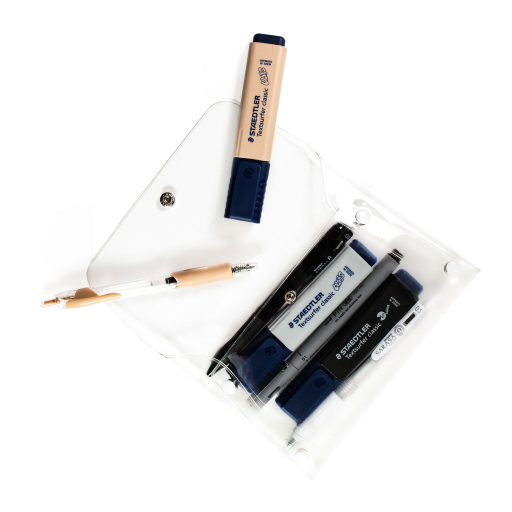 Pouch with pens and highlighters inside it, visible through the pouch's clear material. A highlighter and a pen rest on the opened top flap.