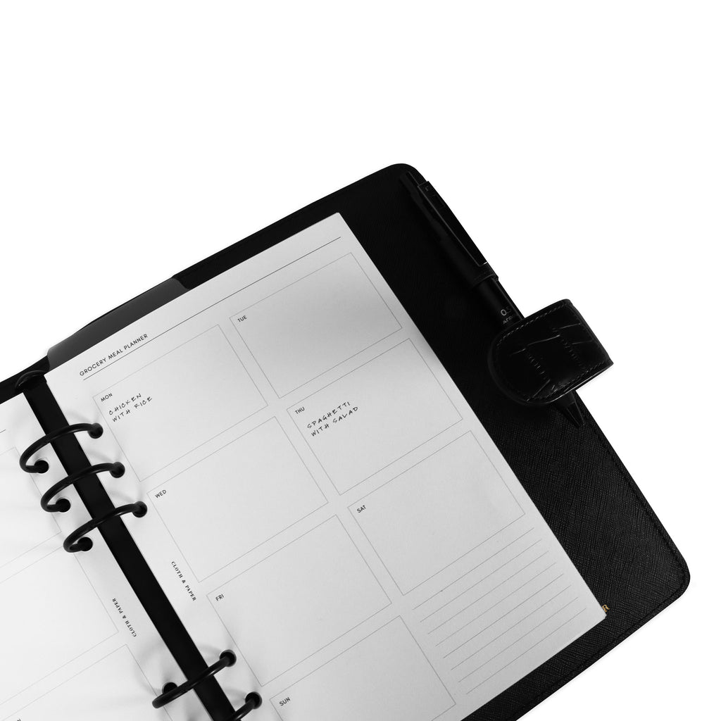 Inserts in use inside a black leather planner.