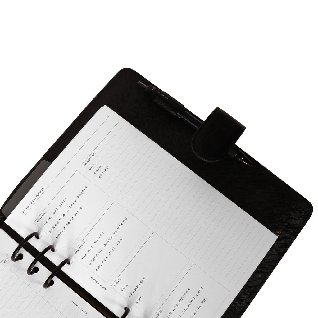 Inserts in use inside a black leather agenda.