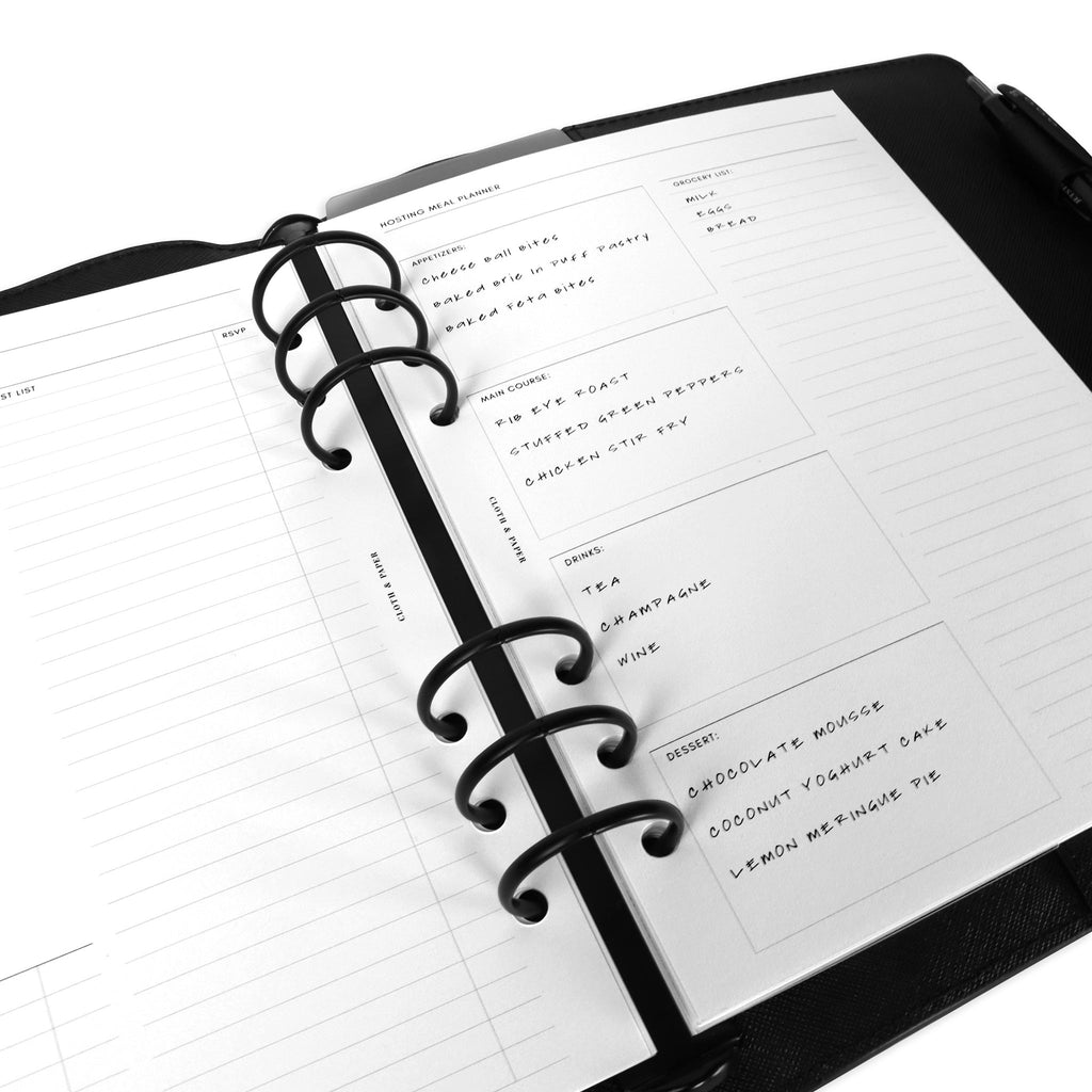 Inserts in use inside a black leather agenda.