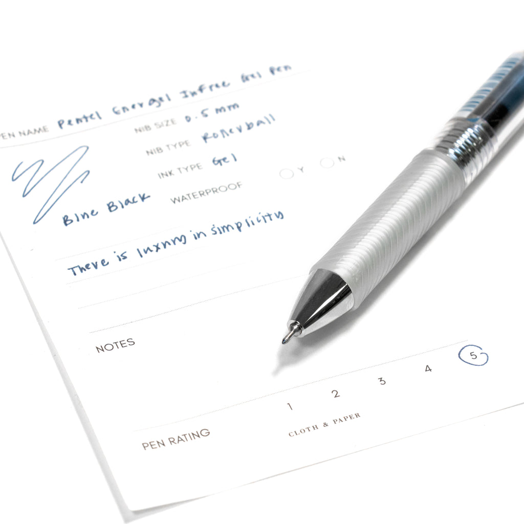 Pentel Energel Infree Gel Pen, Blue-Black, Cloth and Paper. Close up on pen nib resting on pen test sheet.