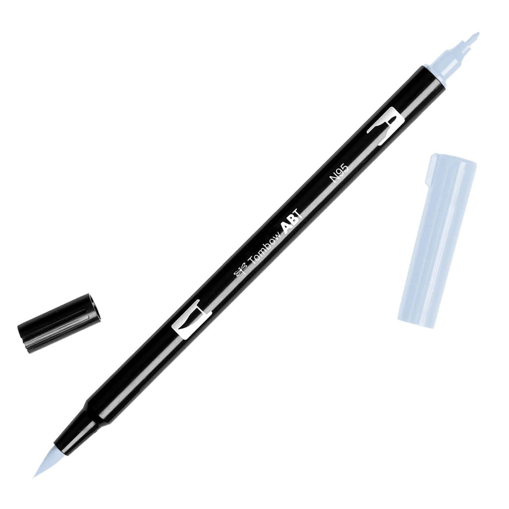 Tombow Dual Brush Art Marker, Cool Gray 1, Cloth & Paper. Art marker turned slightly to the right on a white background. It is uncapped on both ends showing the brush tip and fine tip.